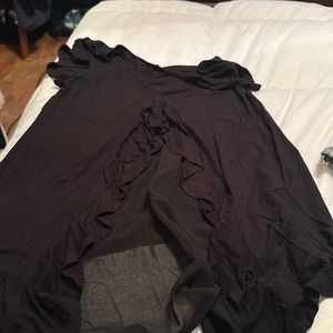 Black shirt with ruffled back.